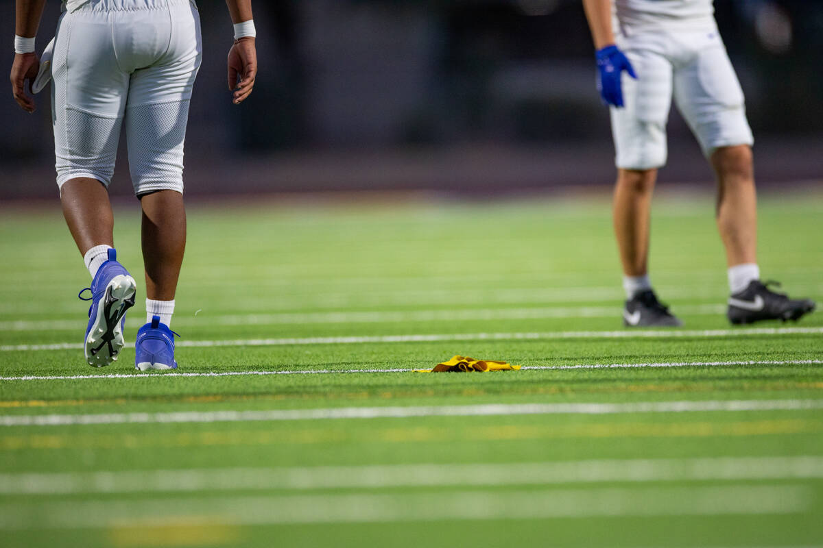 A penalty flag hits the ground at Durango High School in Las Vegas Aug. 15, 2025 during a match ...