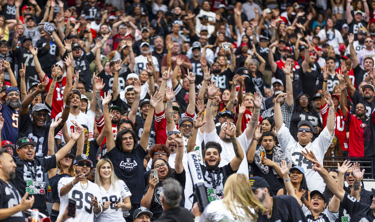 Raiders fans hope for a free t-shirt during the second half of their pre-season NFL game agains ...