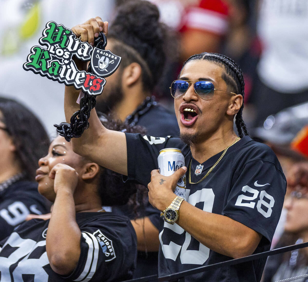 A raiders fan cheers the team on against the San Francisco 49ers during the second half of thei ...