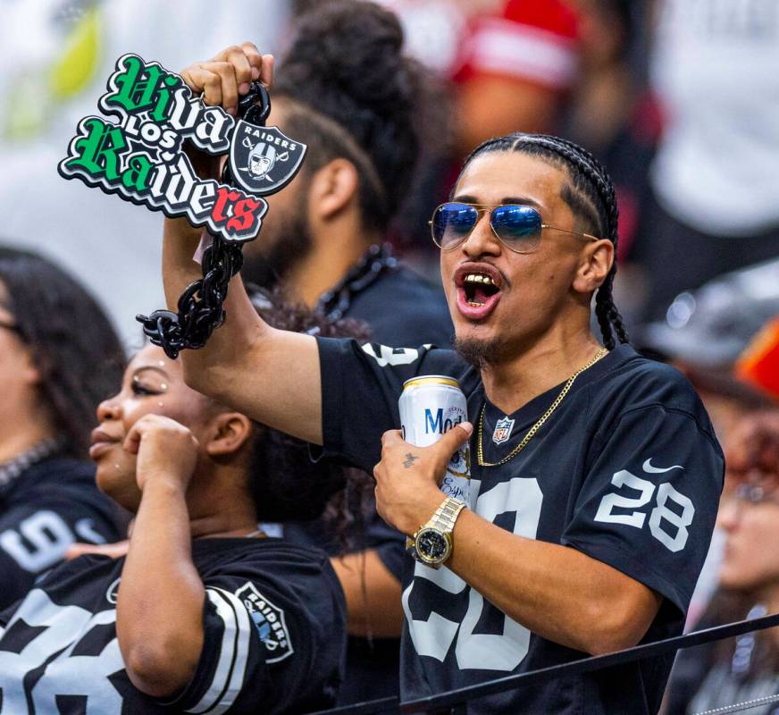 A raiders fan cheers the team on against the San Francisco 49ers during the second half of thei ...