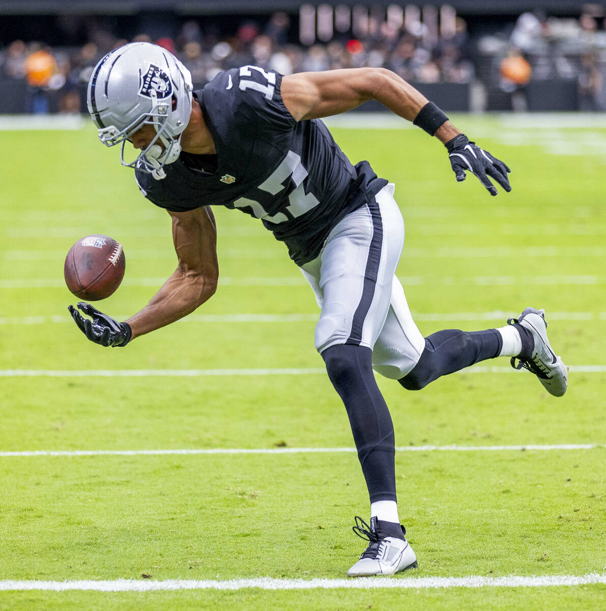 Raiders wide receiver Collin Johnson (17) catches a pass during warm ups of their pre-season NF ...