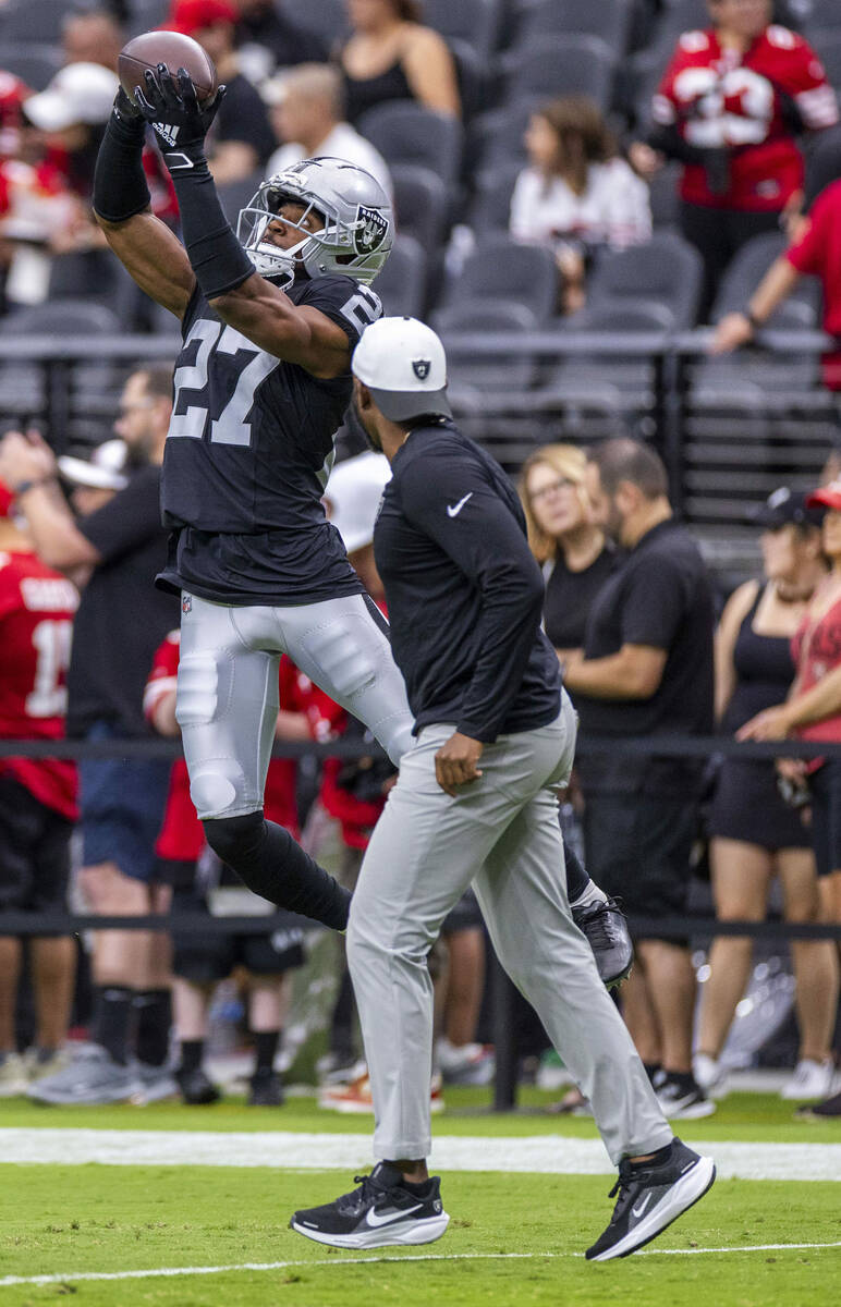 Raiders cornerback Sam Webb (27) elevates for a catch during warm ups of their pre-season NFL g ...