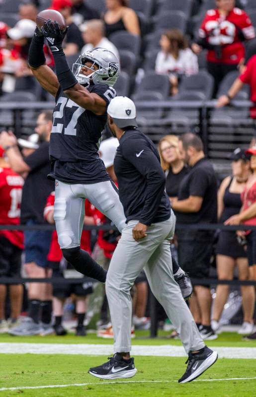 Raiders cornerback Sam Webb (27) elevates for a catch during warm ups of their pre-season NFL g ...
