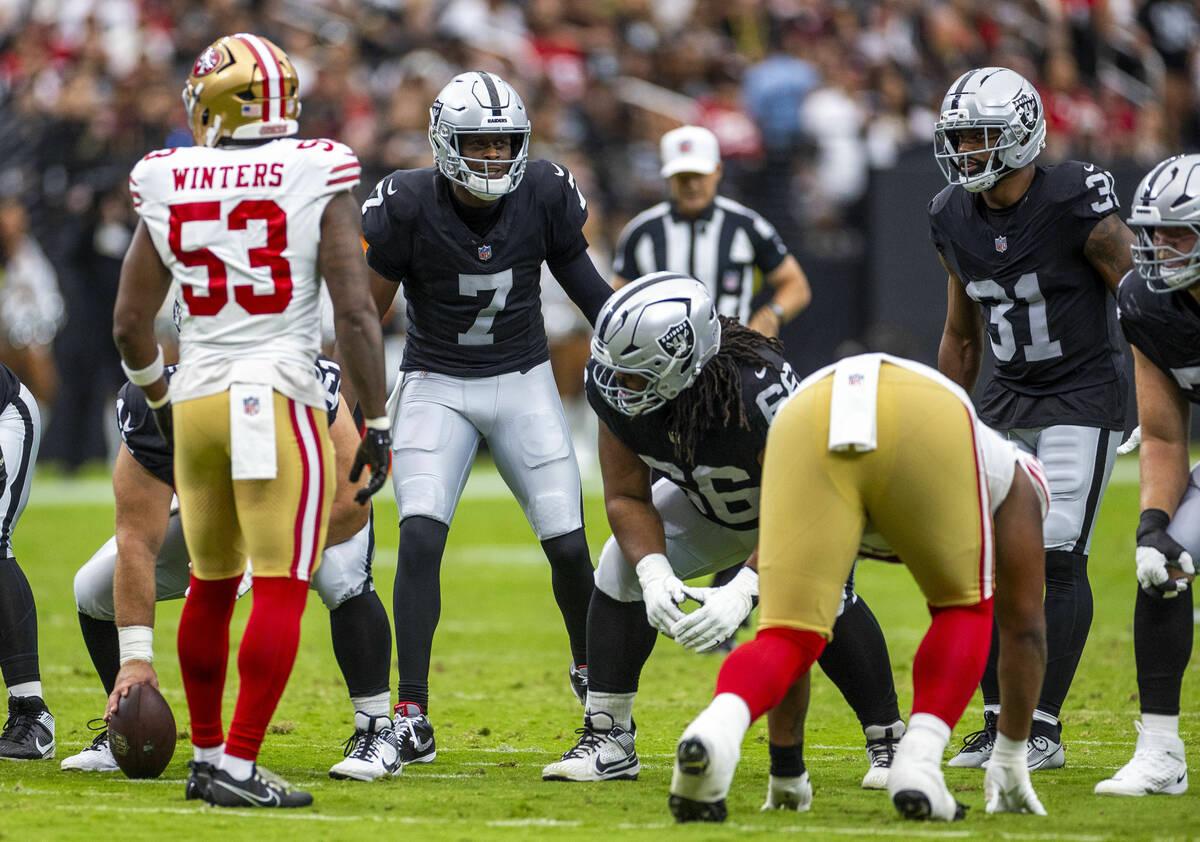Raiders quarterback Geno Smith (7) calls a play against the San Francisco 49ers during the firs ...