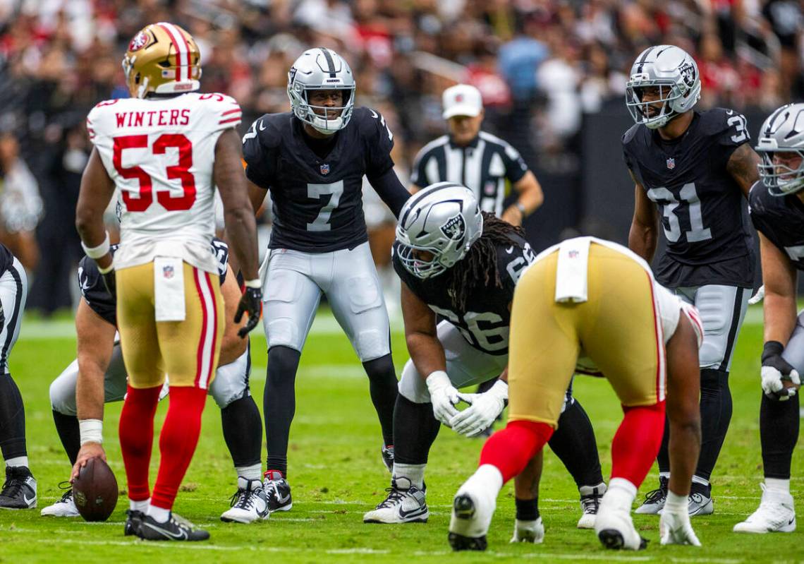 Raiders quarterback Geno Smith (7) calls a play against the San Francisco 49ers during the firs ...