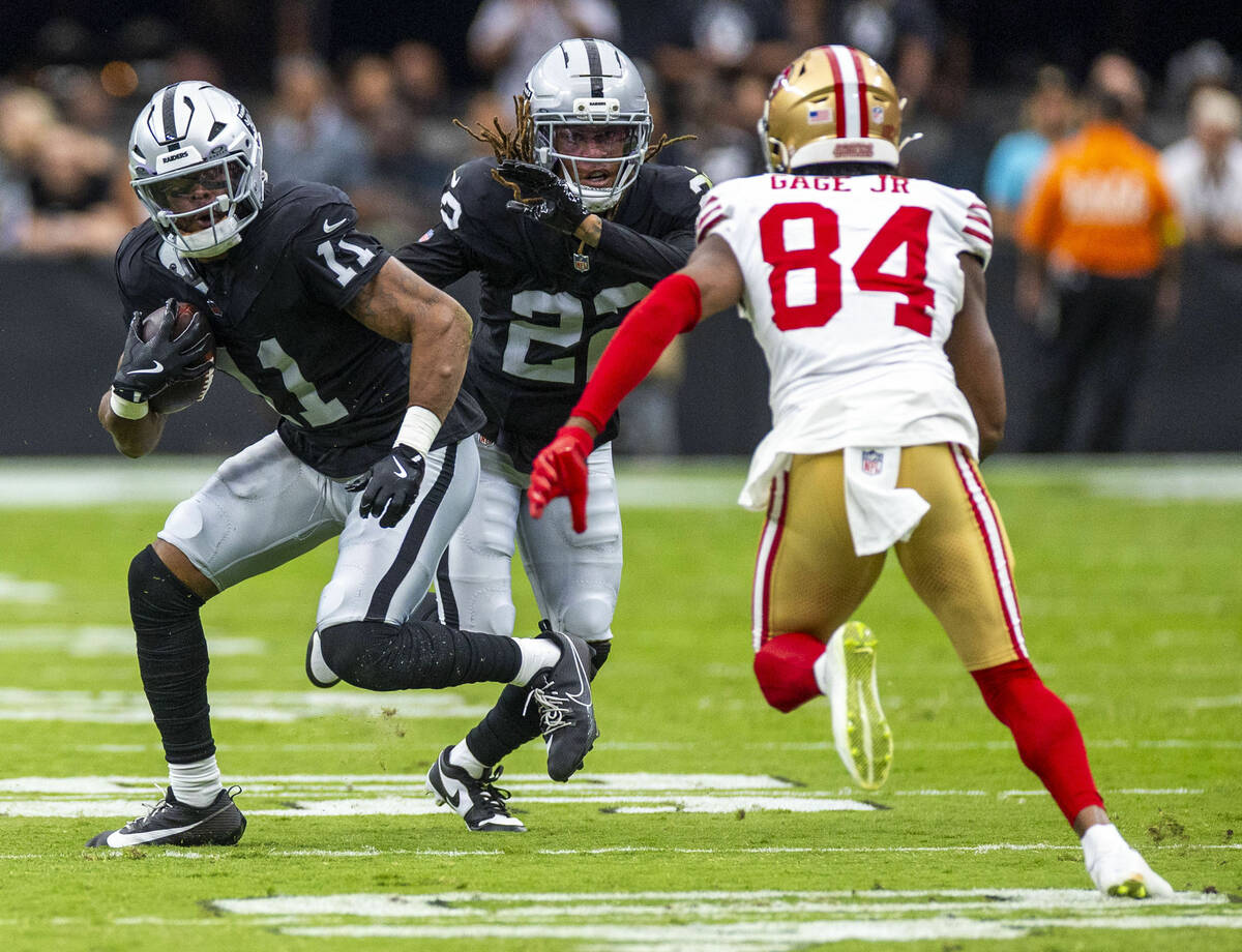 Raiders safety Jeremy Chinn (11) secures an interception and looks to run back against San Fran ...