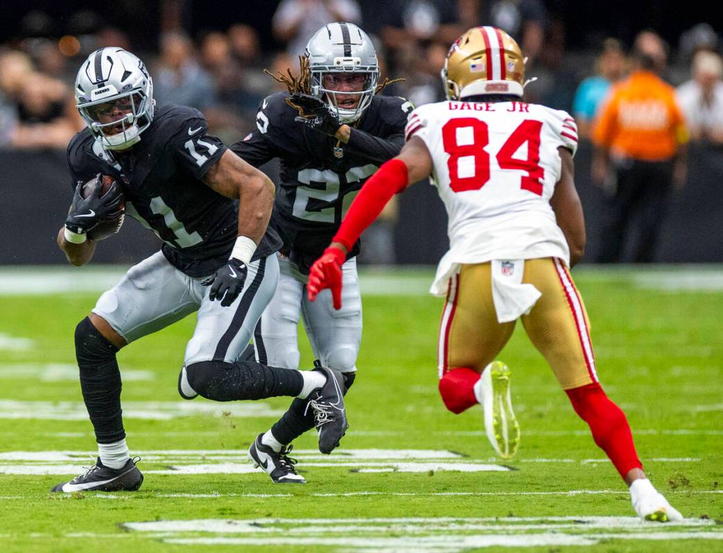 Raiders safety Jeremy Chinn (11) secures an interception and looks to run back against San Fran ...