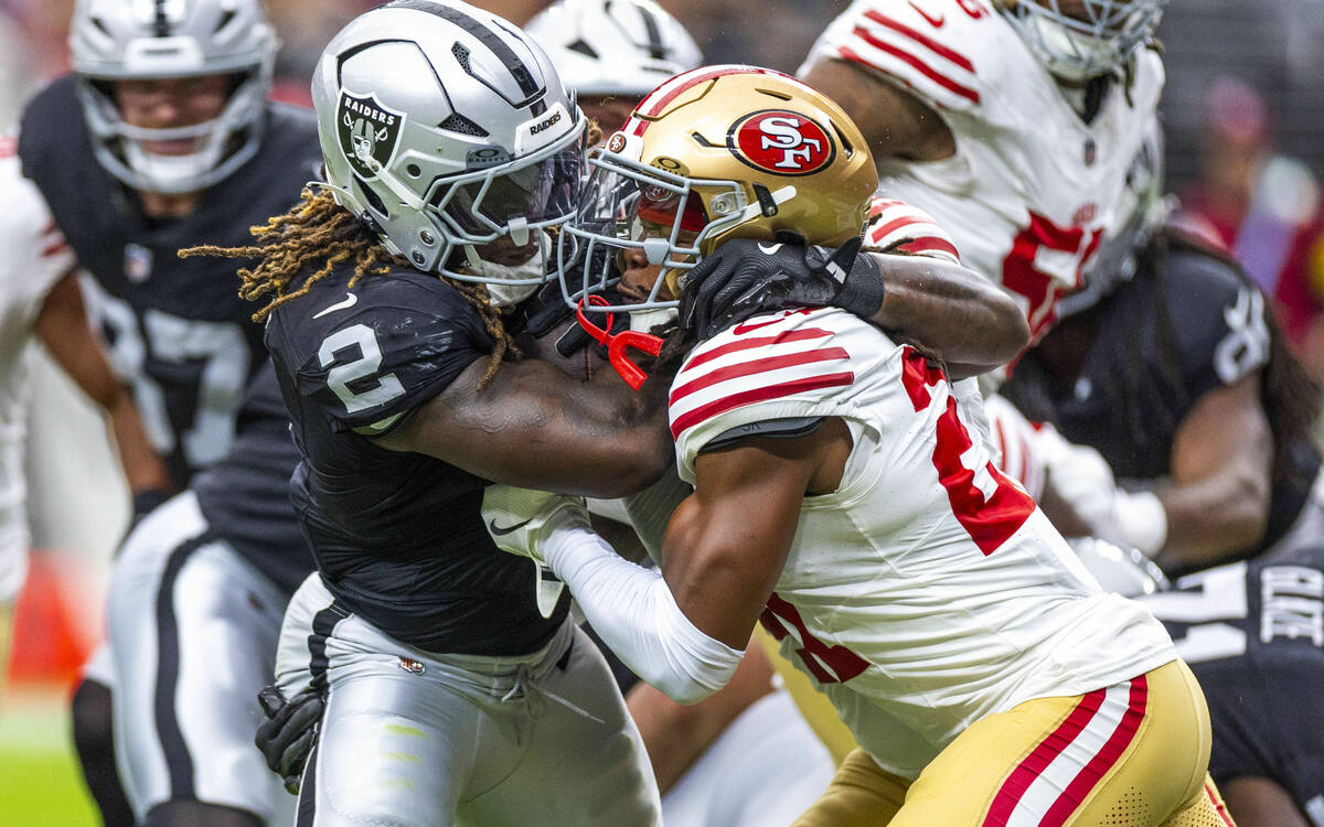 Raiders running back Ashton Jeanty (2) collides with San Francisco 49ers safety Ji'Ayir Brown ( ...