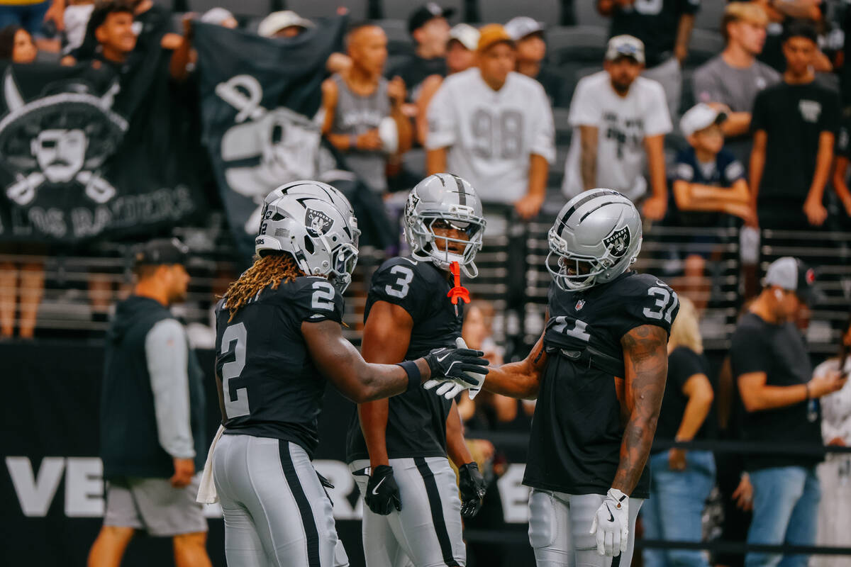 Raiders running back Ashton Jeanty (2), Raiders running back Zamir White (3) and Raiders runnin ...