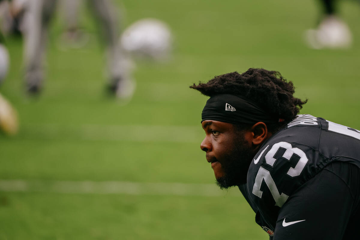 Raiders defensive tackle Tank Booker (73) stretches before the Raiders host the San Francisco 4 ...