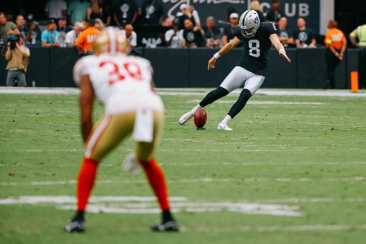 Raiders place kicker Daniel Carlson (8) kicks during the first half of the game on Saturday, Au ...