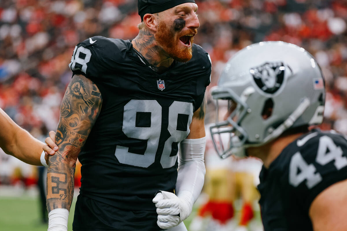 Raiders defensive end Maxx Crosby (98) celebrates a teammate’s tackle during the first h ...