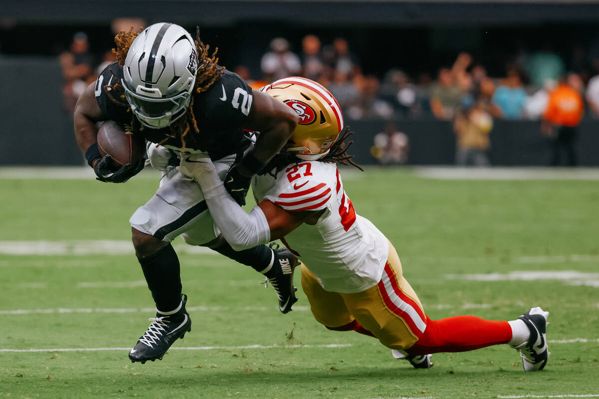 San Francisco 49ers safety Ji'Ayir Brown (27) tackles Raiders running back Ashton Jeanty (2) du ...