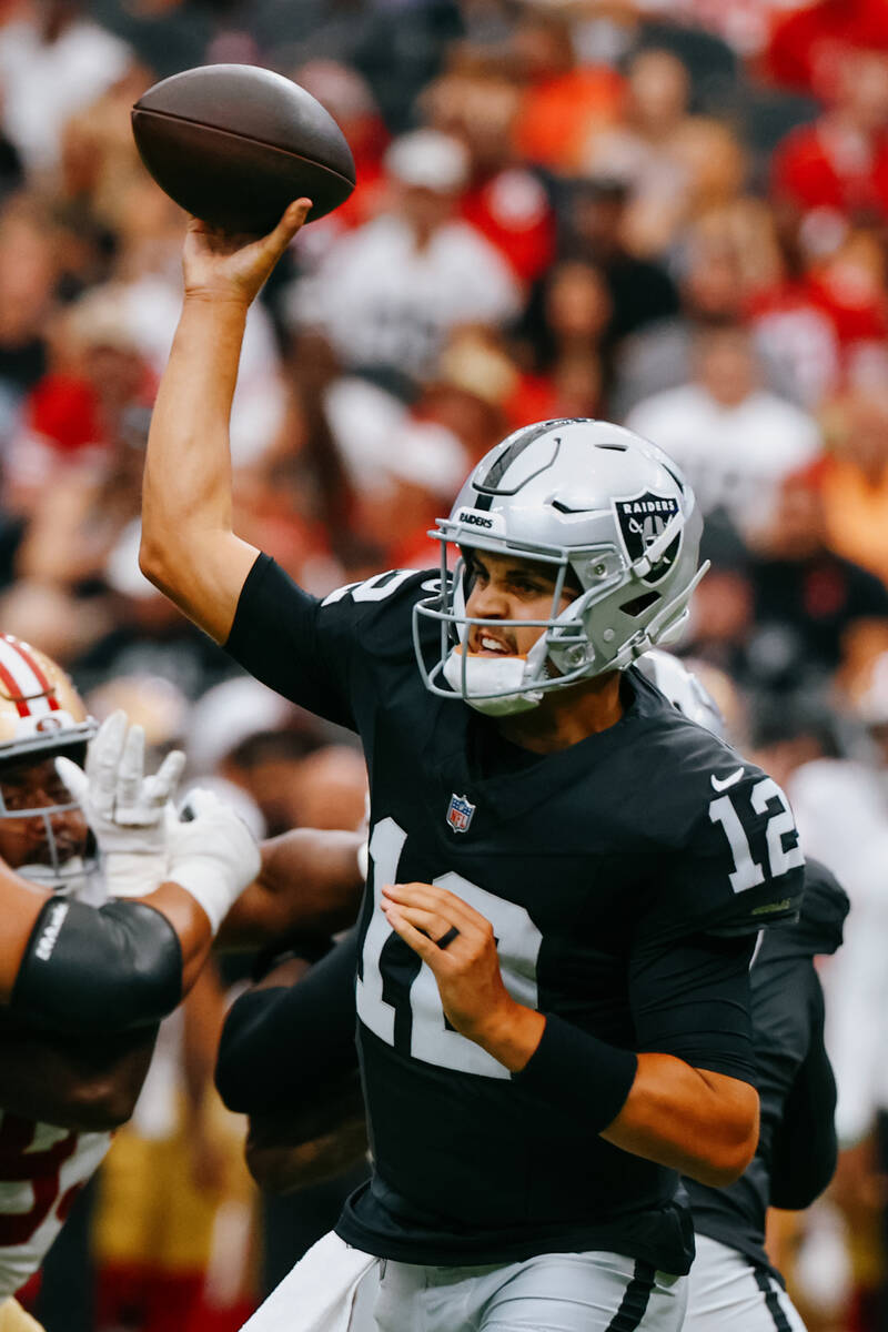 Raiders quarterback Aidan O'Connell (12) winds up a pass during the first half of the game on S ...