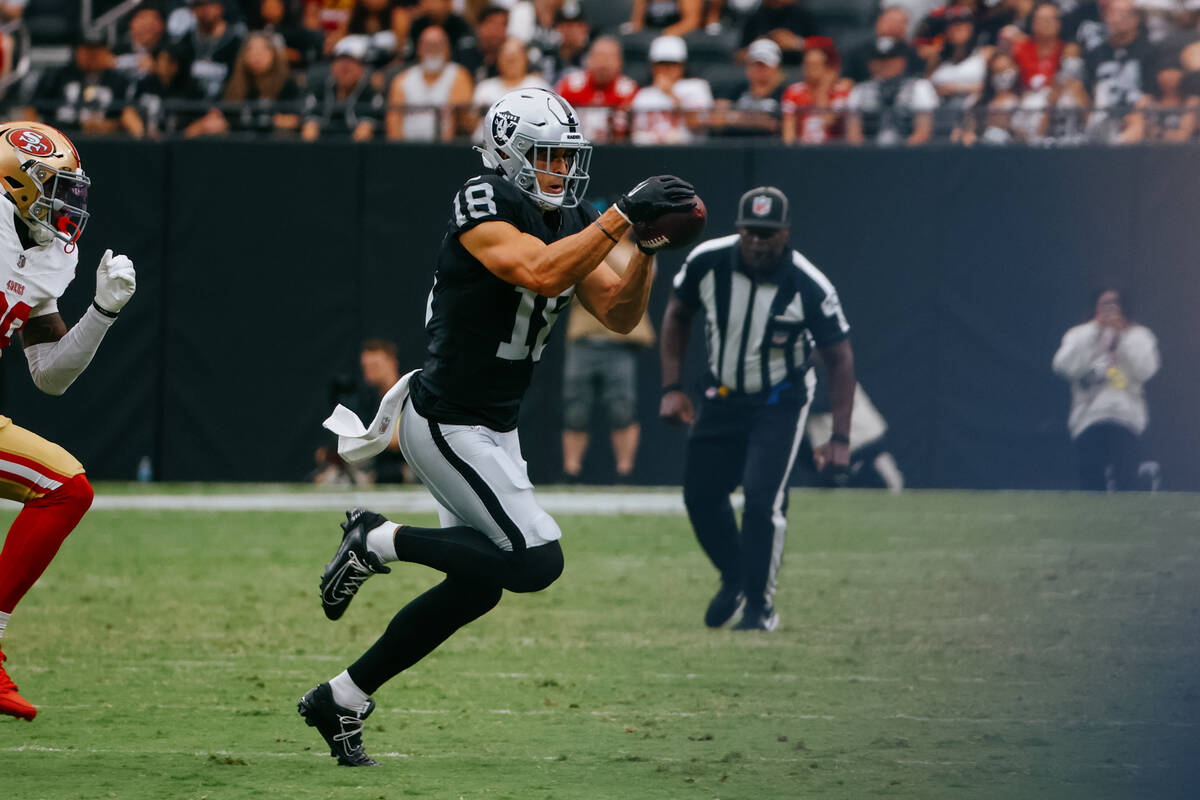 Raiders wide receiver Jack Bech (18) catches a pass during the first half of the game on Saturd ...