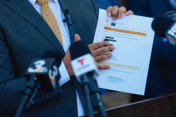 Athar Haseebullah, the executive director of the ACLU of Nevada, holds up what he said was a pr ...