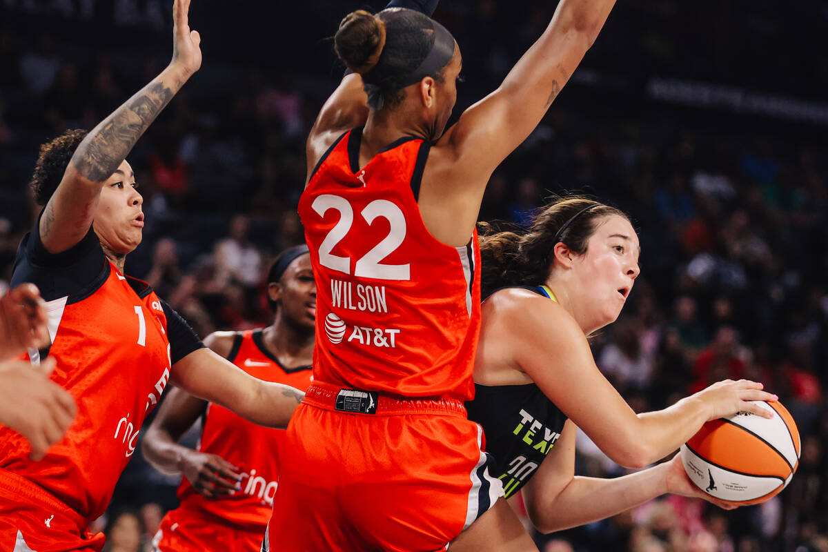 Dallas Wings forward Maddy Siegrist (20) truest find an open teammate during a WNBA basketball ...