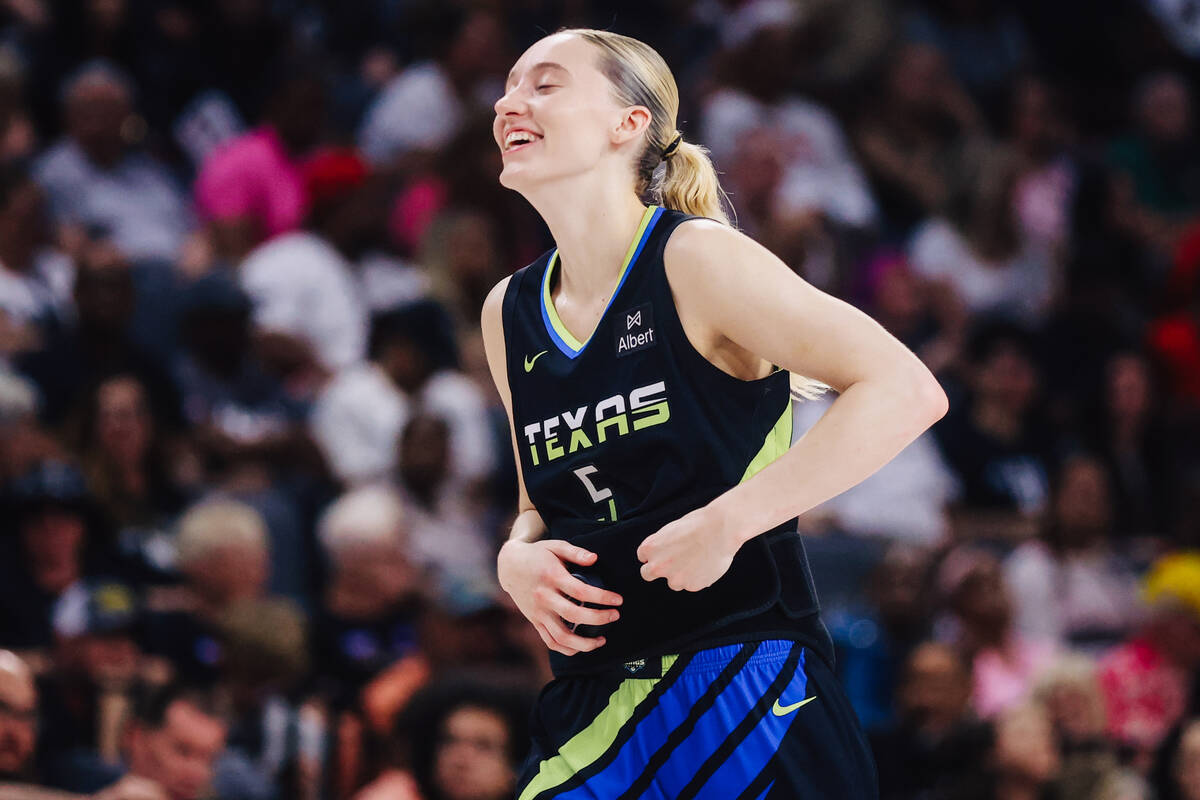 Dallas Wings guard Paige Bueckers (5) laughs during a WNBA basketball game between the Aces and ...