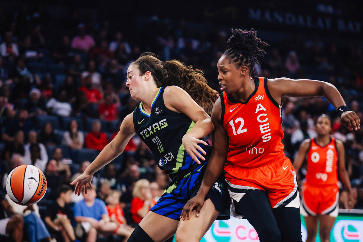Dallas Wings forward Maddy Siegrist (20) and Aces guard Chelsea Gray (12) close in on the ball ...