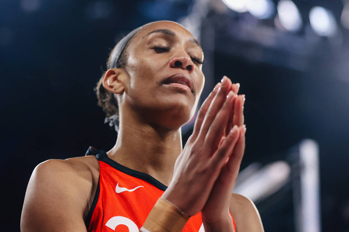 Aces center A'ja Wilson (22) reacts after drawing a foul during a WNBA basketball game between ...