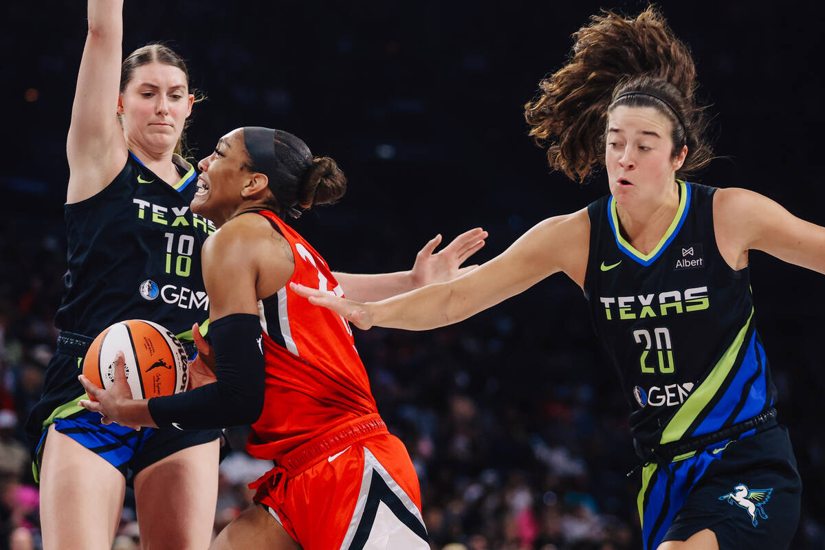Aces center A'ja Wilson (22) drives the ball to the basket during a WNBA basketball game betwee ...
