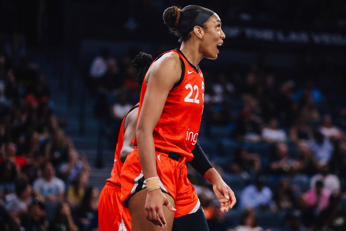 Aces center A'ja Wilson reacts after drawing a foul during a WNBA basketball game between the A ...