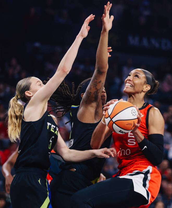 Aces center A'ja Wilson (22) looks to put up a shot against the Dallas Wings during a WNBA bask ...