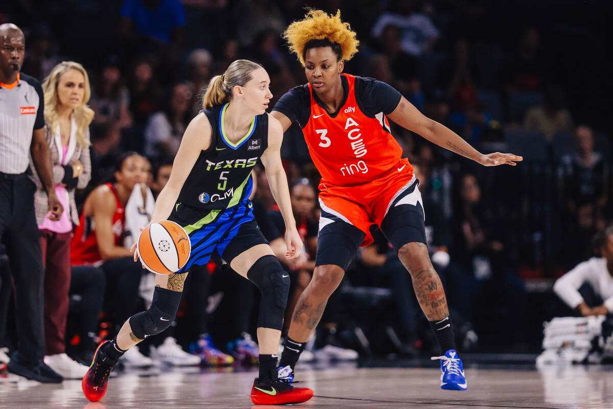 Dallas Wings guard Paige Bueckers (5) dribbles the ball as Aces forward NaLyssa Smith (3) guard ...