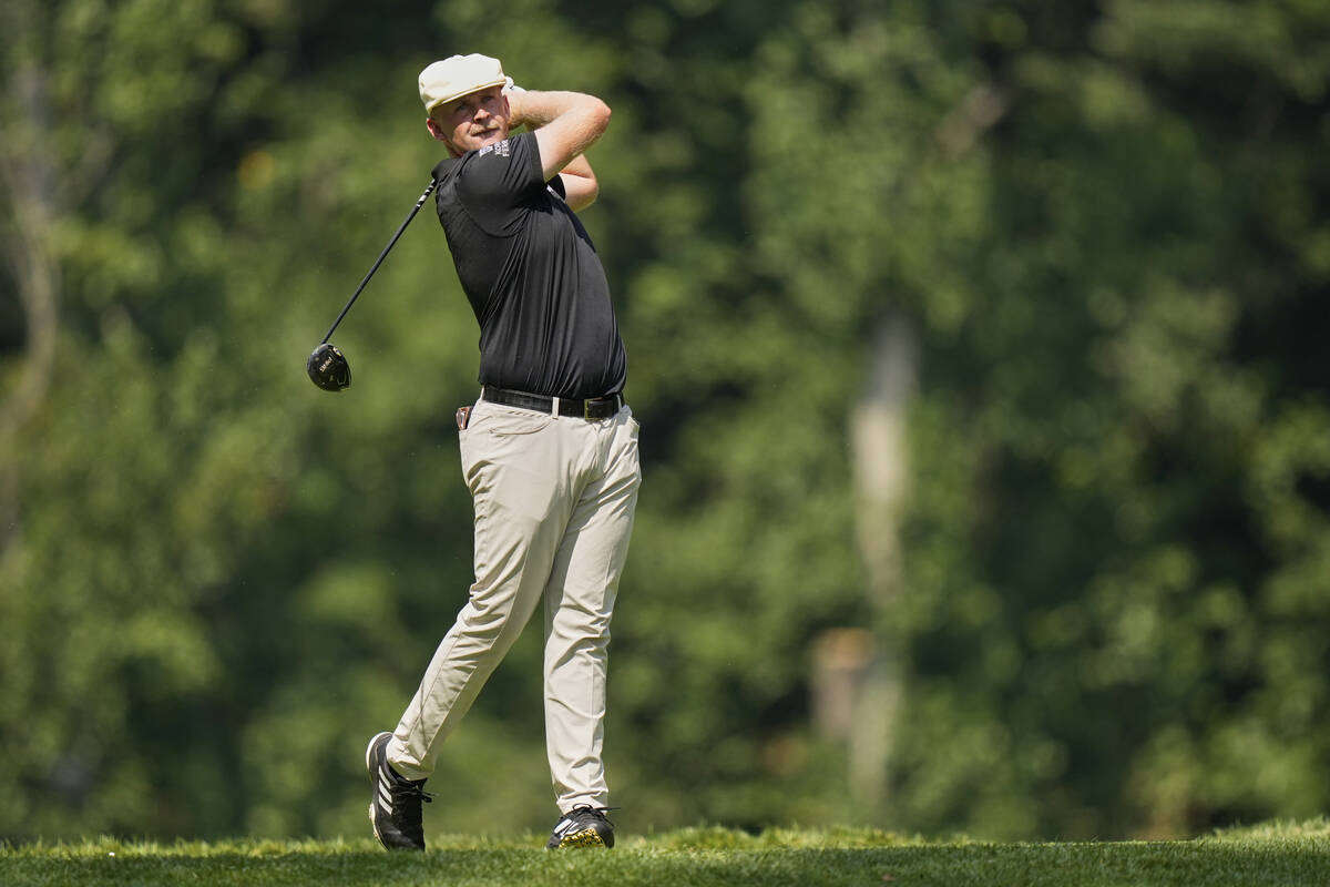 Harry Hall, of England, hits off the seventh tee during the final round of the BMW Championship ...