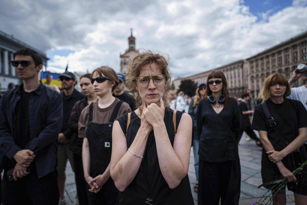 A woman mourns during the farewell ceremony of David Chichkan, a Ukrainian serviceman and artis ...