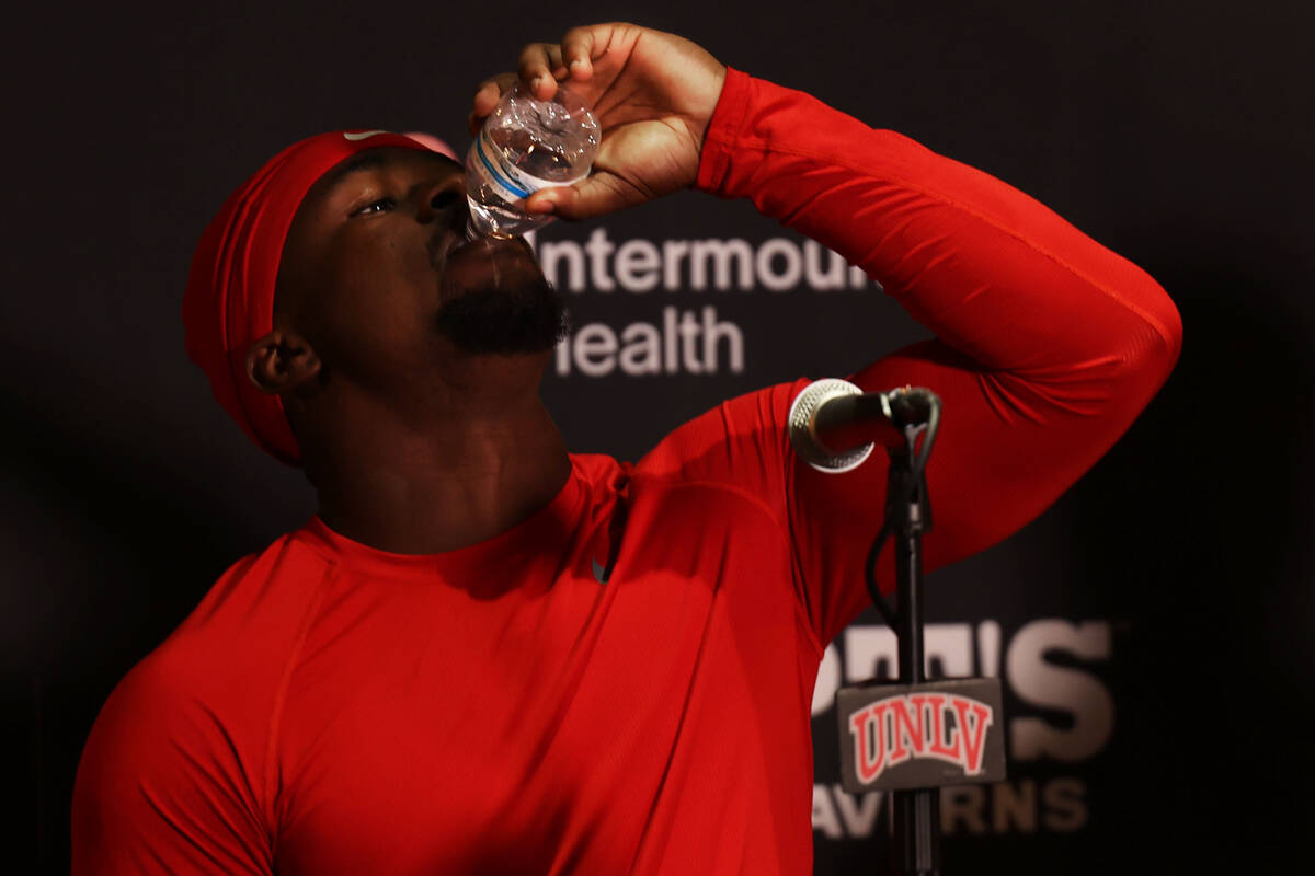 UNLV running back Jayden Thomas takes a drink of water during a press conference at the Fertitt ...