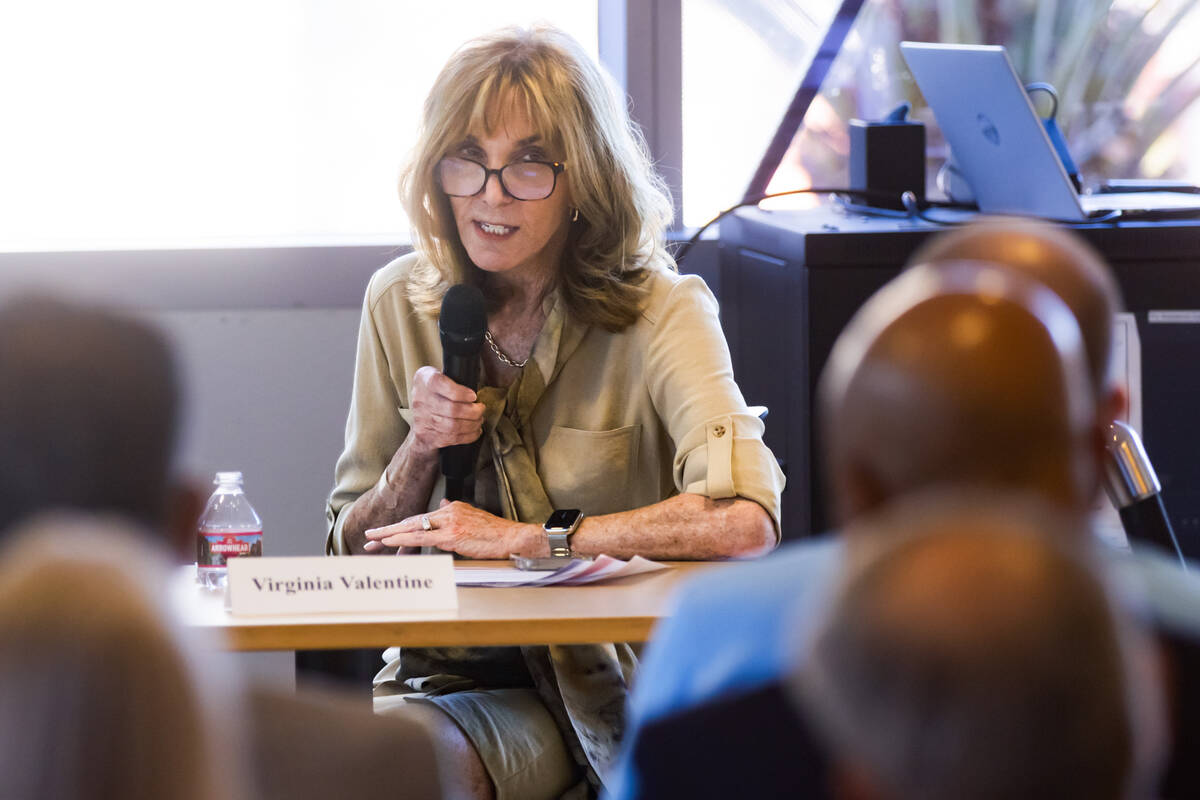 Virginia Valentine, president and CEO of the Nevada Resort Association, center, speaks during a ...