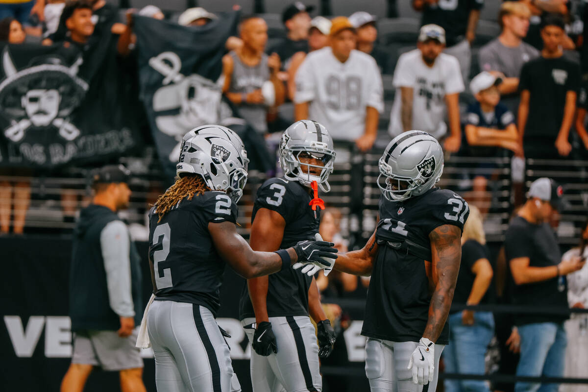 Raiders running back Ashton Jeanty (2), Raiders running back Zamir White (3) and Raiders runnin ...