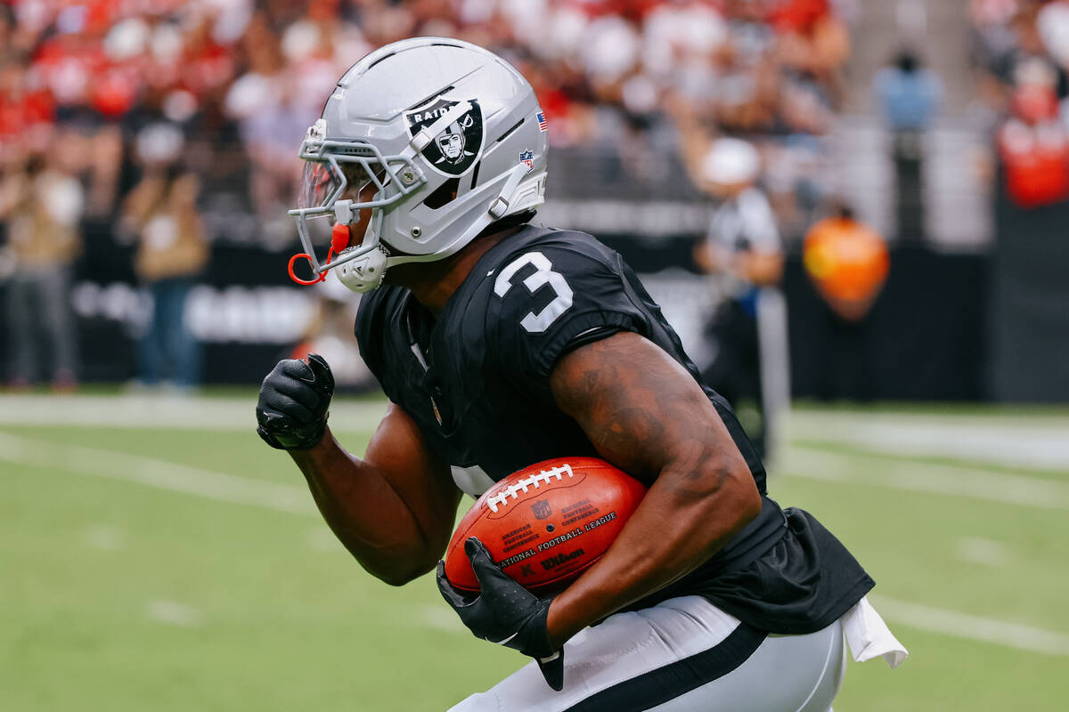 Raiders running back Zamir White (3) returns a punt during the first half of the game on Saturd ...