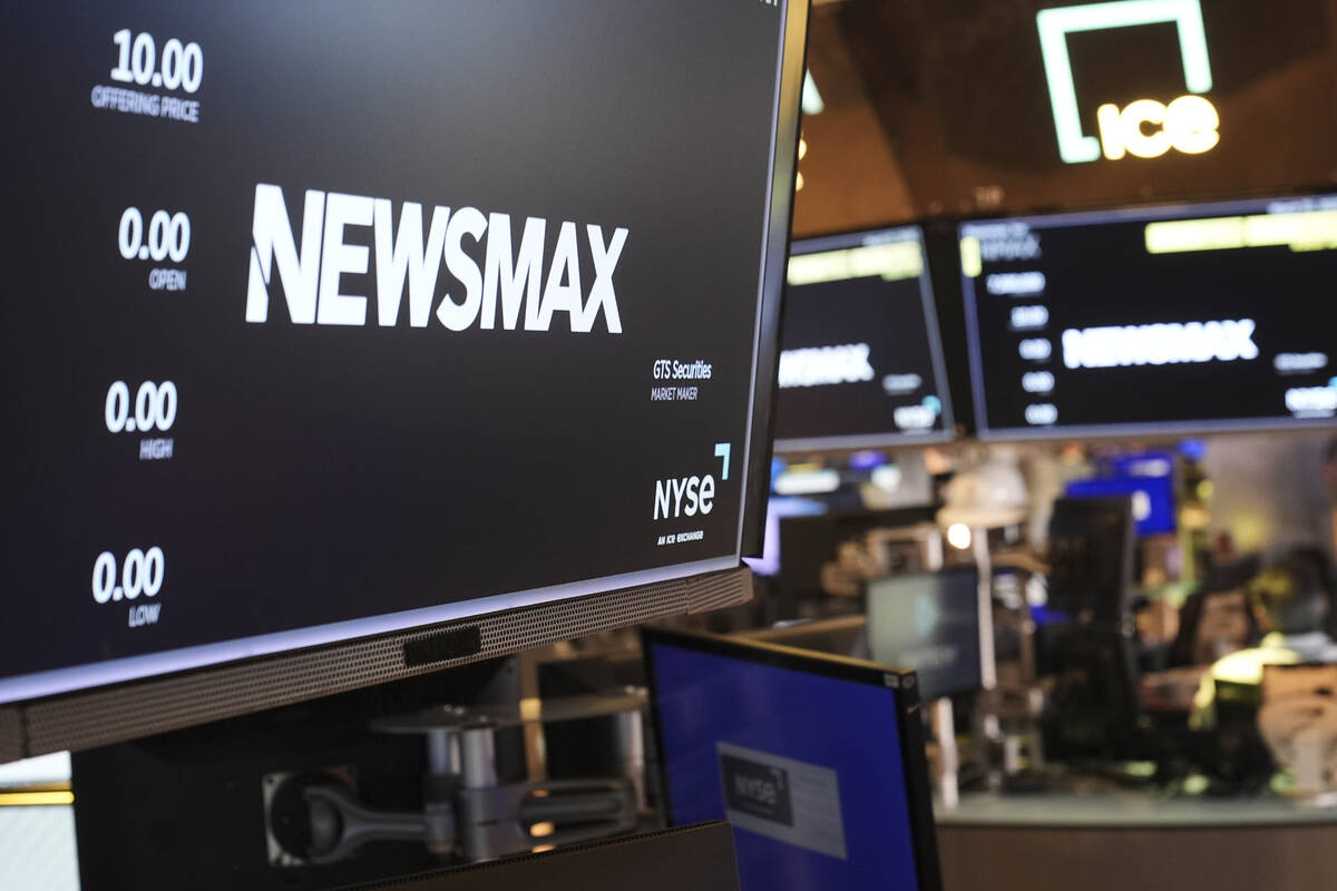 A display shows a Newsmax logo on the day of their IPO on the floor at the New York Stock Excha ...