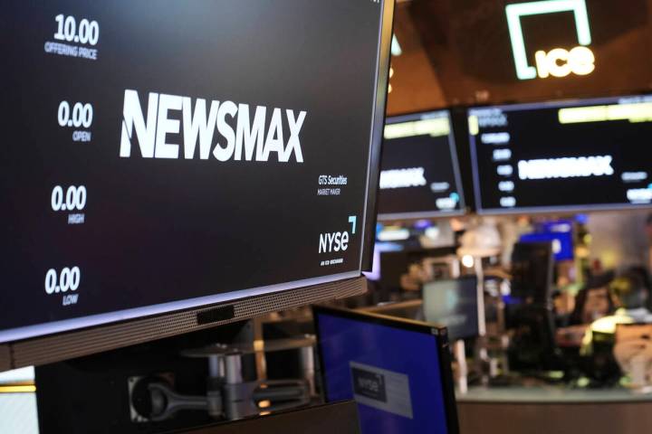 A display shows a Newsmax logo on the day of their IPO on the floor at the New York Stock Excha ...