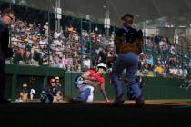Las Vegas, Nev.'s Griffin Vargas, center, slides into home to win a baseball game against ...