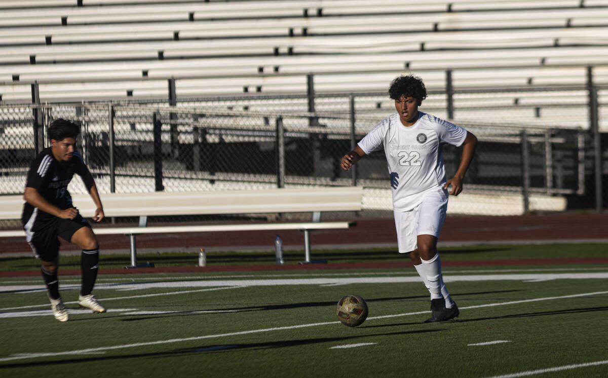 Desert Oasis' Victor Juarez (22) kicks the ball during a soccer game at Palo Verde High School ...