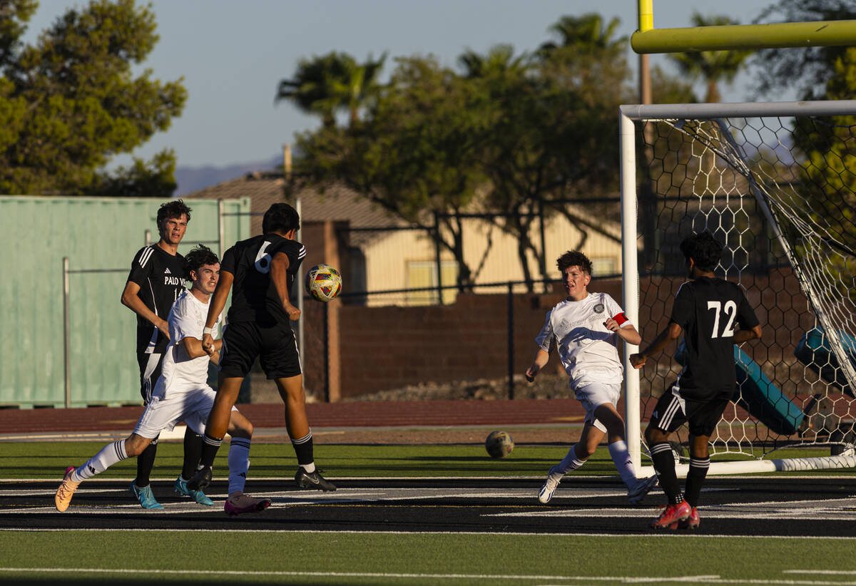 Palo Verde's Augstin Soto (6) heads the ball against Desert Oasis during a soccer game at Palo ...