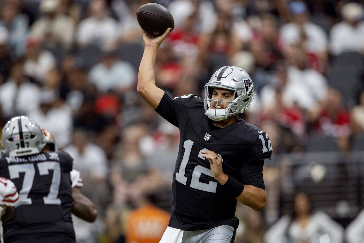 Raiders quarterback Aidan O'Connell (12) throws against the San Francisco 49ers during the seco ...
