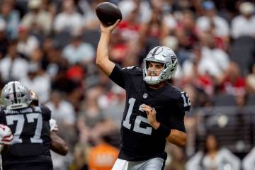 Raiders quarterback Aidan O'Connell (12) throws against the San Francisco 49ers during the seco ...