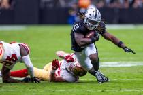 Raiders running back Ashton Jeanty (2) breaks free from a tackle attempt by San Francisco 49ers ...