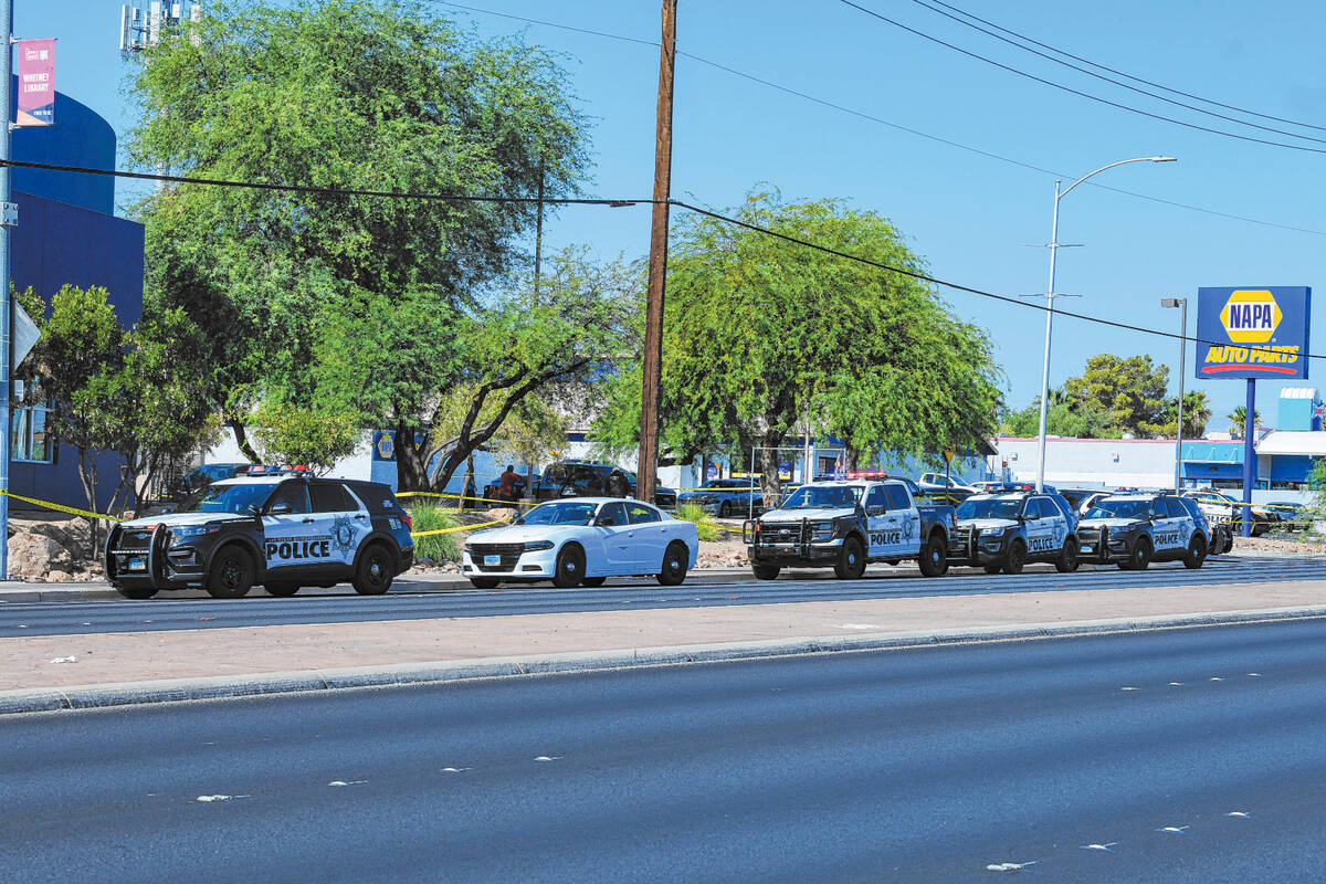 Metropolitan Police Department officers investigate the scene of a stabbing on the 5100 block o ...