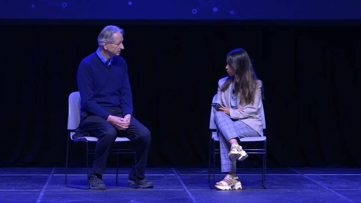 Geoffrey Hinton, left, gives his keynote talk at the Ai4 conference on Tuesday, Aug. 12, 2025 a ...