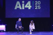 Geoffrey Hinton, left, gives his keynote talk at the Ai4 conference on Tuesday, Aug. 12, 2025 a ...