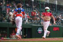 Summerlin South's Griffin Vargas crosses home plate against Clarendon Hills, Ill. in the sixth ...