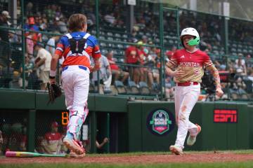 Summerlin South's Griffin Vargas crosses home plate against Clarendon Hills, Ill. in the sixth ...