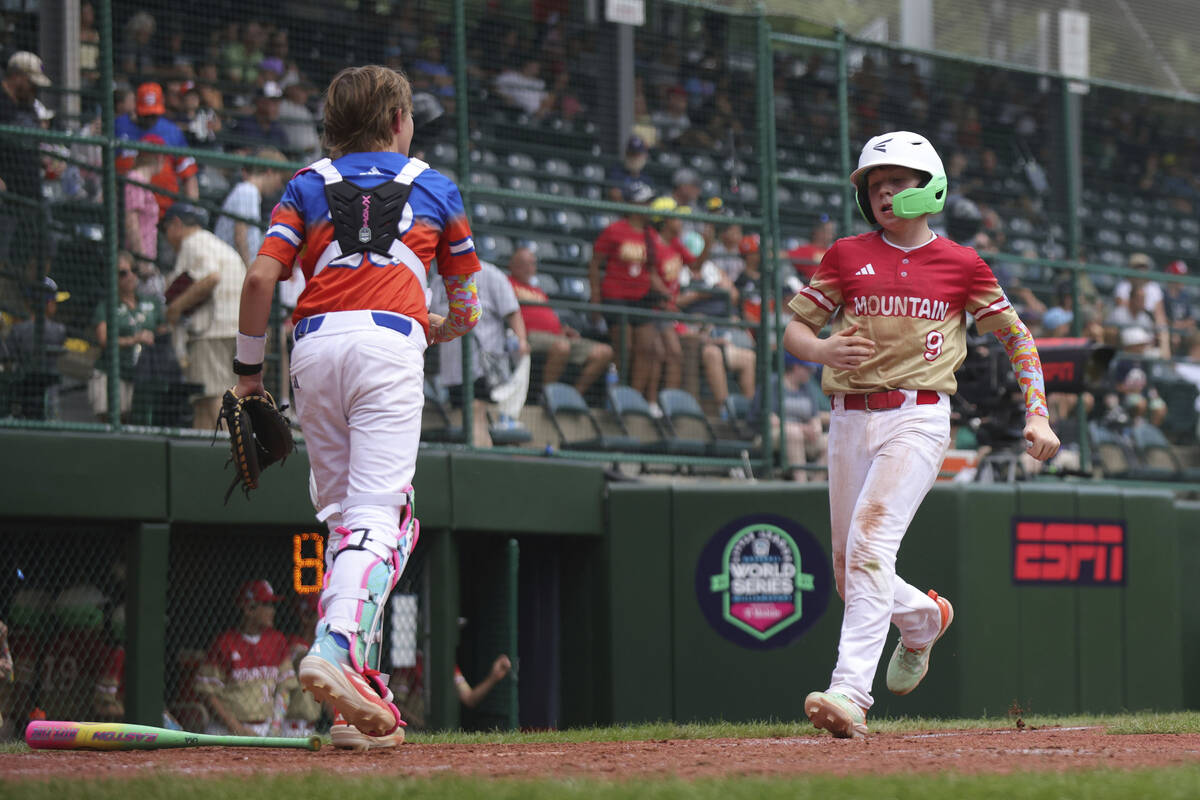 Summerlin South's Griffin Vargas crosses home plate against Clarendon Hills, Ill. in the sixth ...