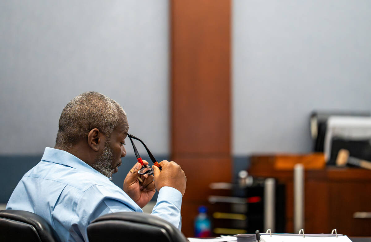 Nathan Williams puts back on his glasses after rubbing his eyes during opening statements of hi ...