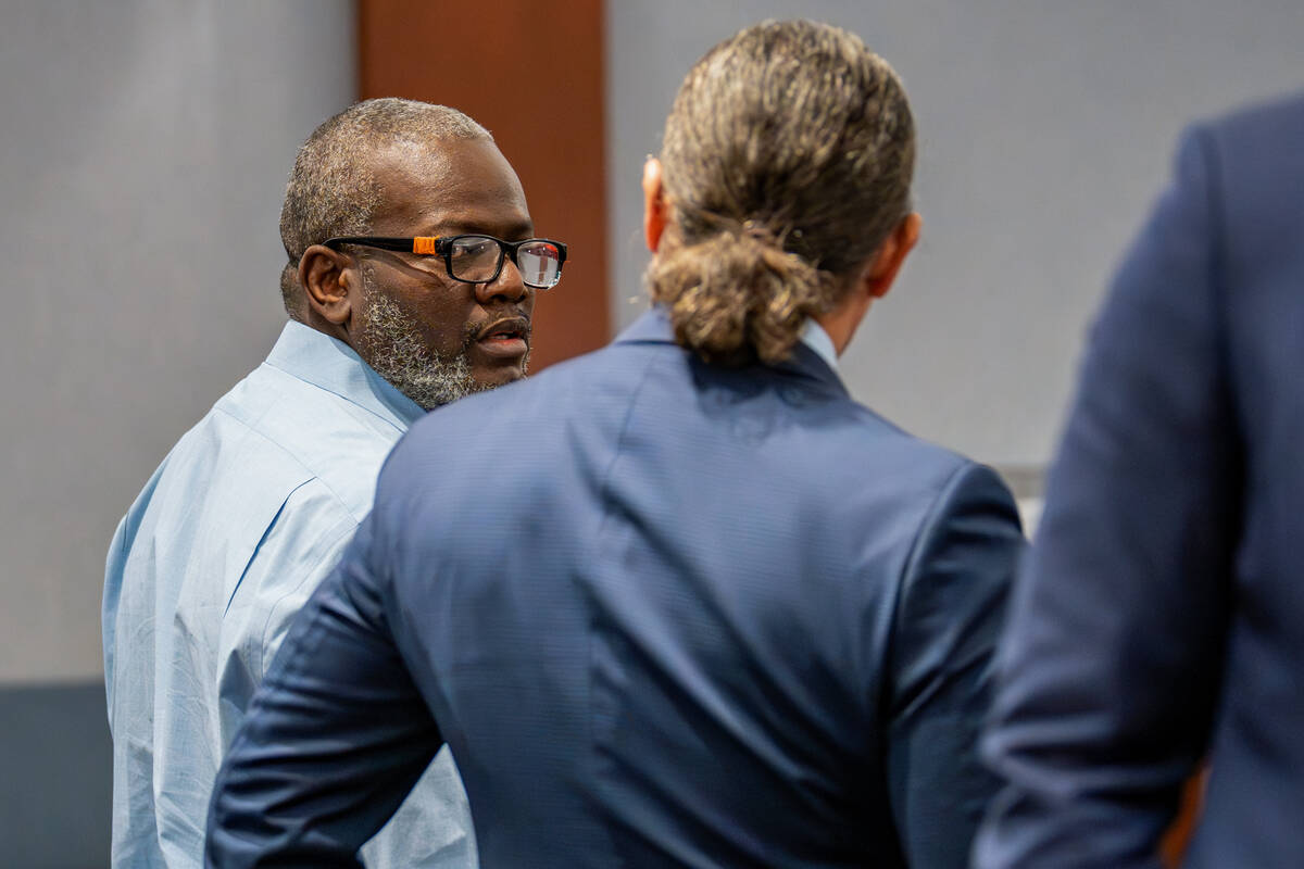 Nathan Williams speaks with his defense attorney, Michael Sanft, following opening statements i ...